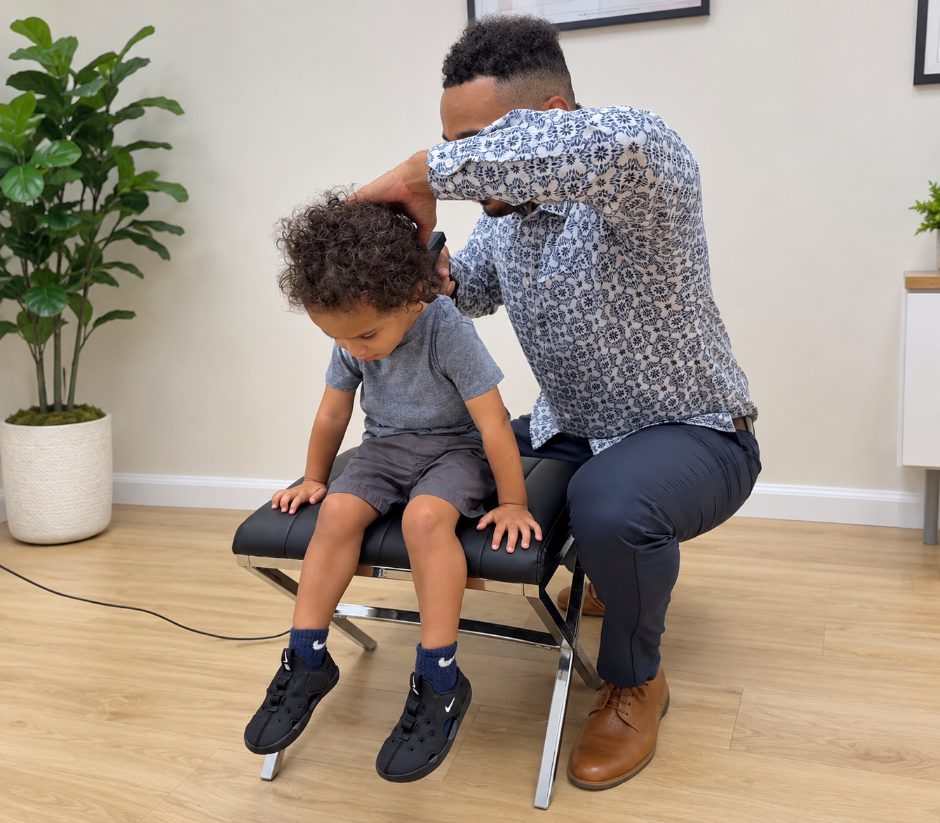 giving a young child a scan in office